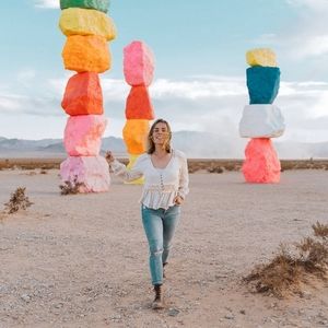 Cream long sleeve frilly top